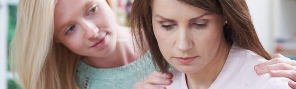 Daughter consoling Mother