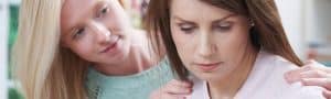 Daughter consoling Mother